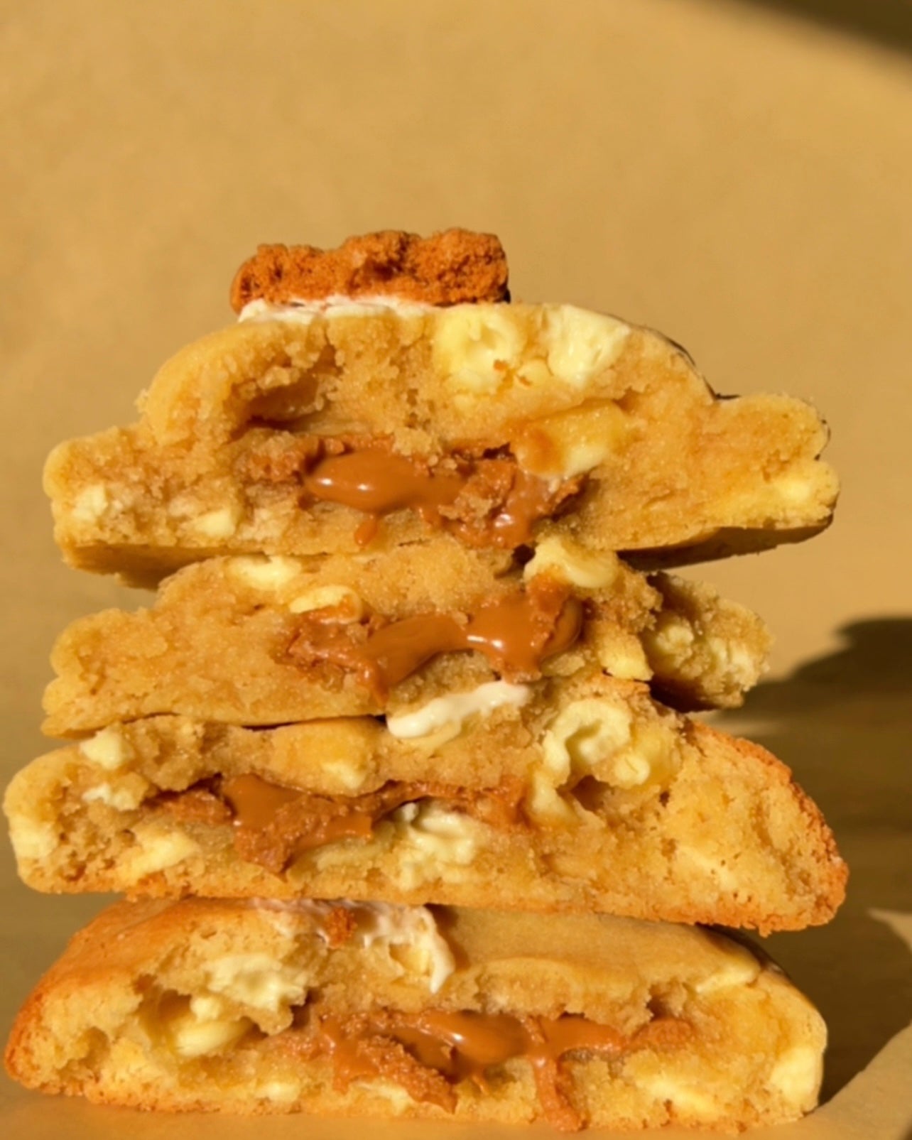 Stack of cookies with biscoff filling on a beige background